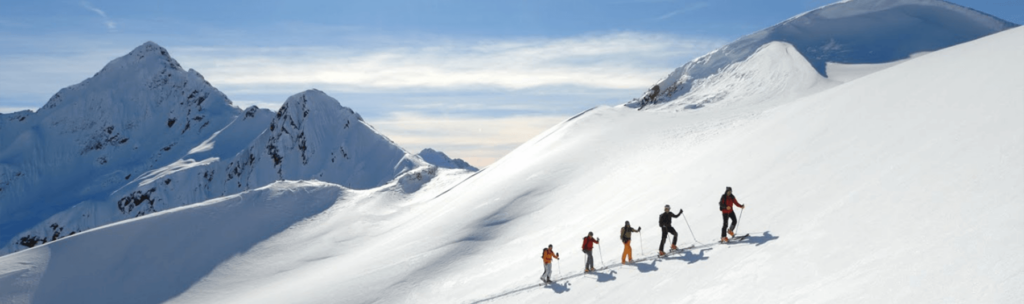 A group of skiers hiking off piste in St. Anton ski resort