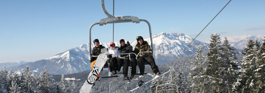 Snowboarders on lift