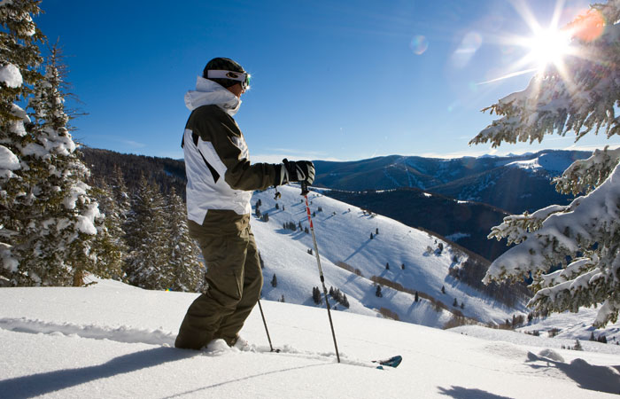 Skier looking toward the sun in Vail