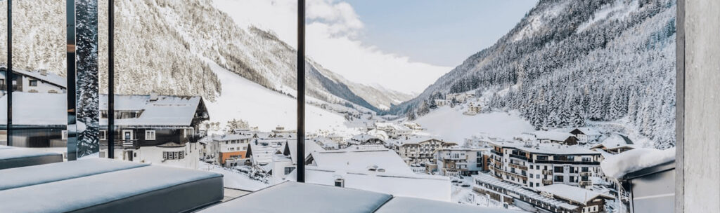 View from a spa hotel room over a snowy ski resort