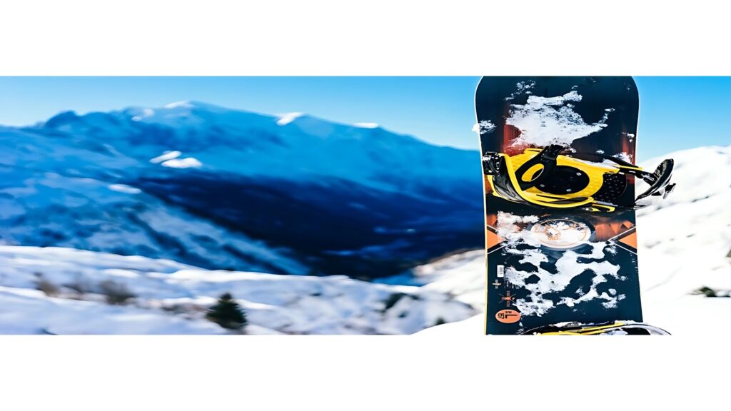 A snowboard standing upright in the snow on a mountain in the Alps