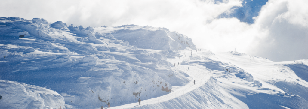 A long ski run in the snowy mountains