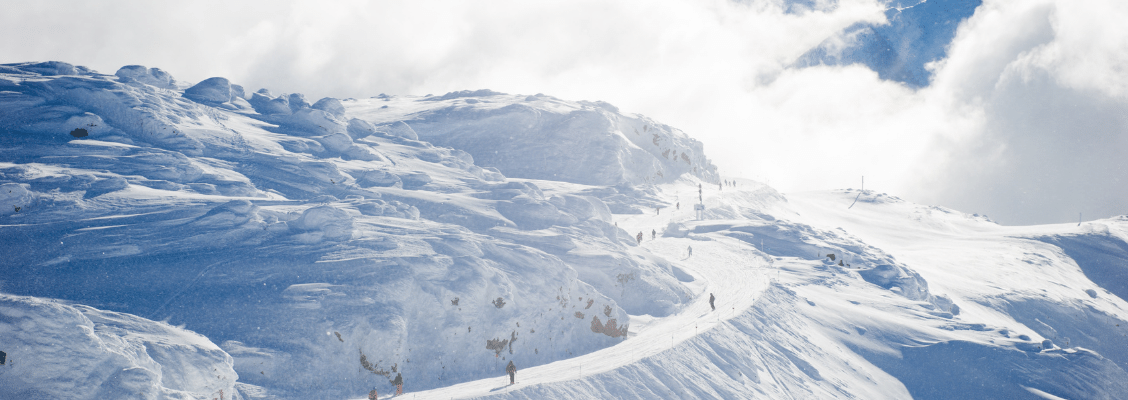 A long ski run in the snowy mountains