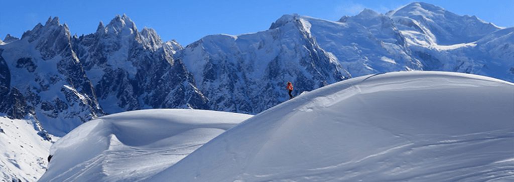A skier skiing off piste in Chamonix ski resort