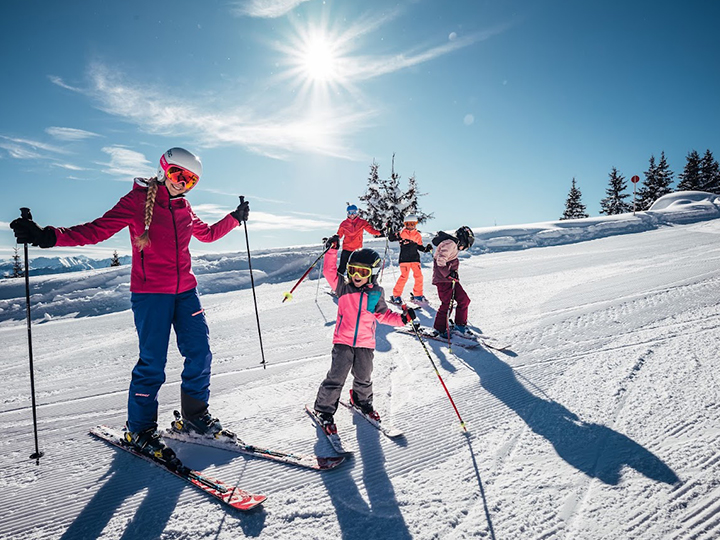 Children learning to ski in Zell Am See