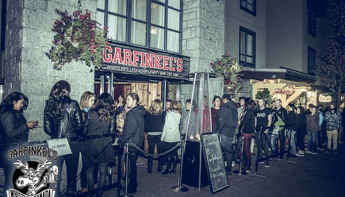 A large queue outside Garfinkel's après ski bar in Whistler