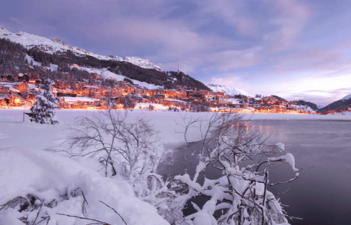 An evening view of St. Moritz from across the lake