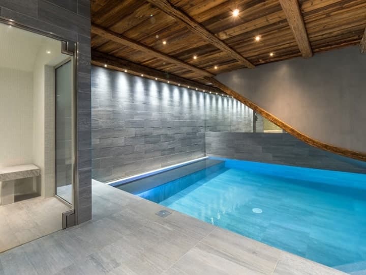 The pool of The Farmhouse, a VIP ski chalet